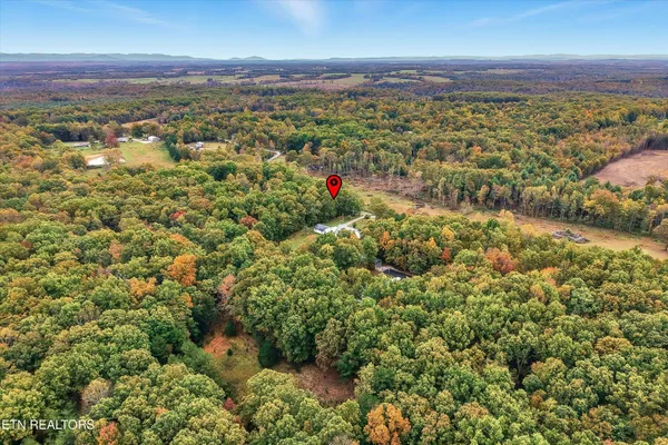 a front view of house with garden