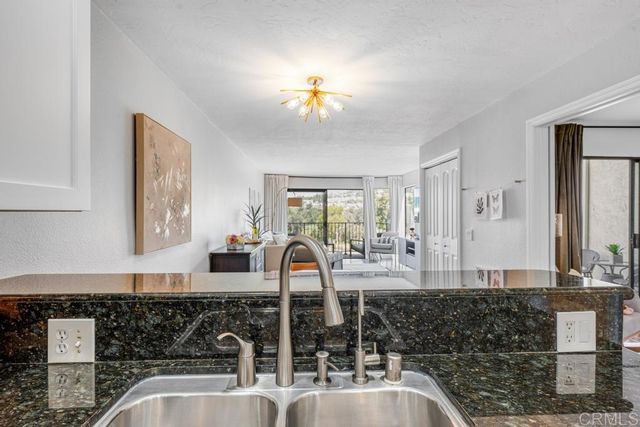 a kitchen with a sink and a window