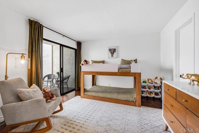 a bedroom with furniture and a window