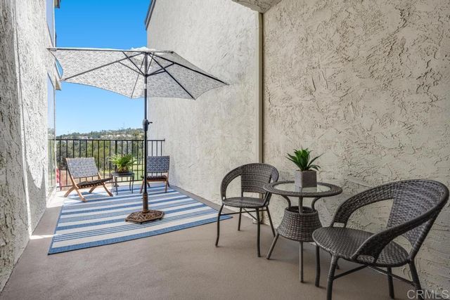 a view of a livingroom with furniture and wooden floor