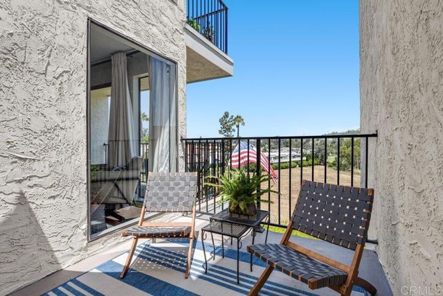 a view of balcony with furniture