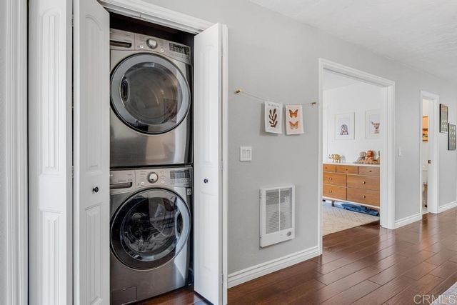 a view of a hallway with washer and dryer