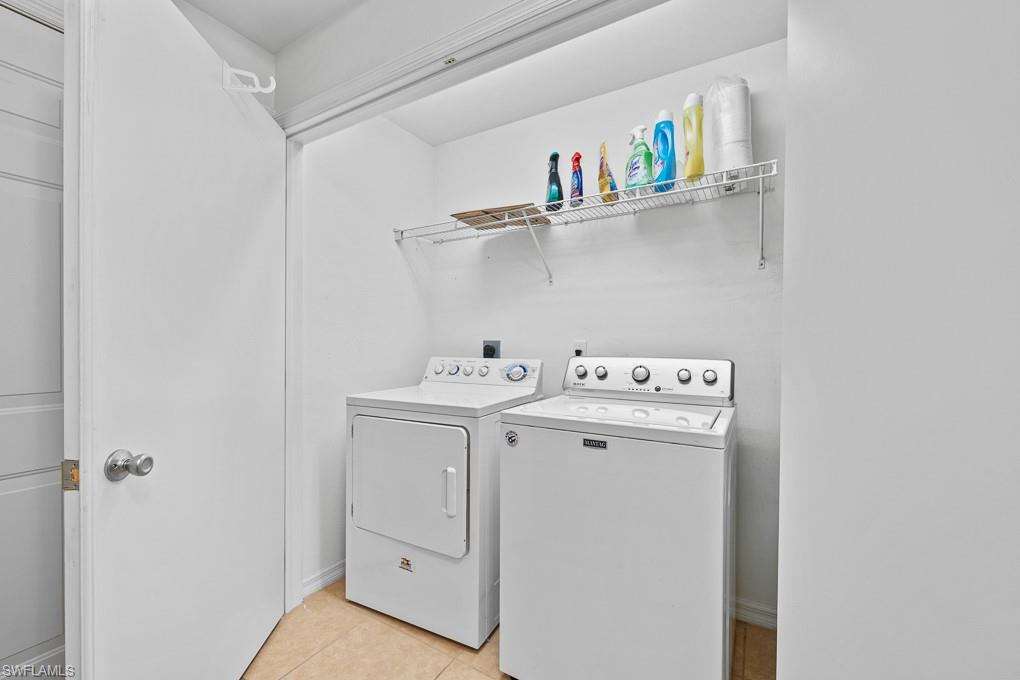 2615 Somerville Loop, Unit 307 Cape Coral, FL 33991 - Photo 21 of 29 a utility room with dryer and washer