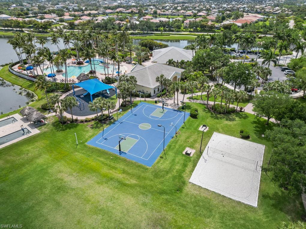 2615 Somerville Loop, Unit 307 Cape Coral, FL 33991 - Photo 26 of 29 an aerial view of a house with a garden and lake view