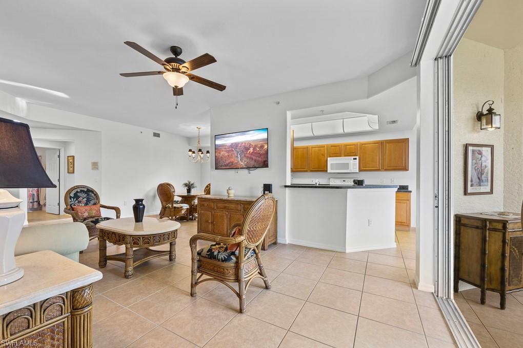 2615 Somerville Loop, Unit 307 Cape Coral, FL 33991 - Photo 5 of 29 a work room with furniture and a view of kitchen