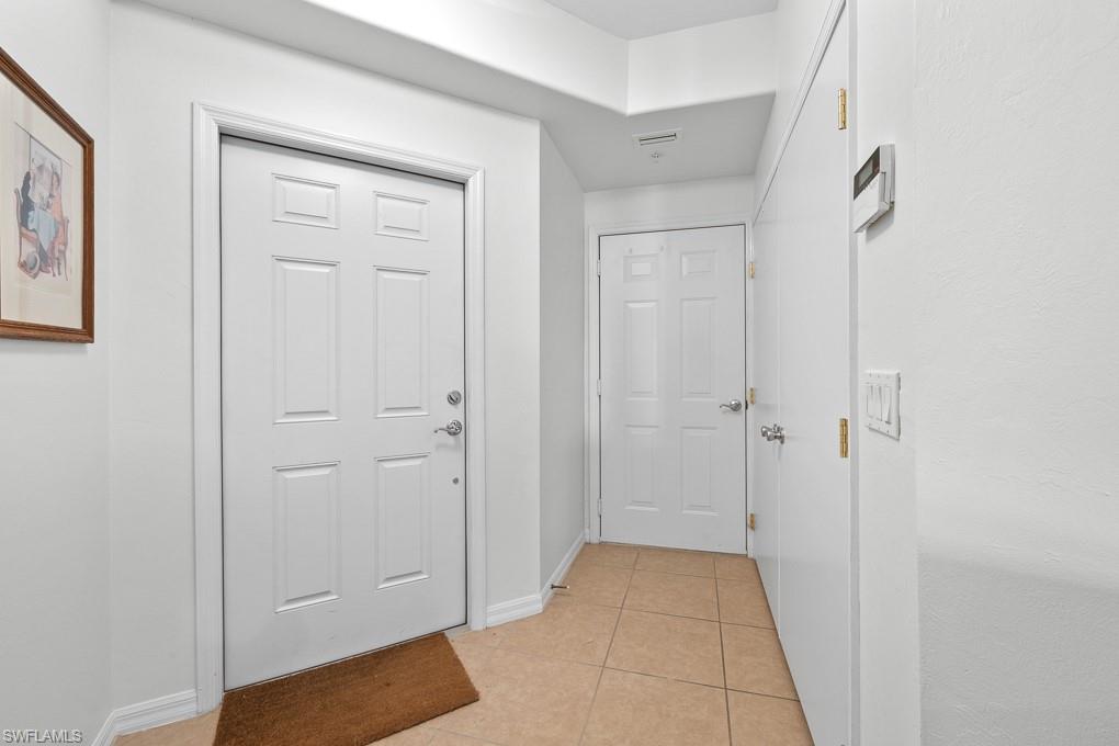 2615 Somerville Loop, Unit 307 Cape Coral, FL 33991 - Photo 7 of 29 a view of a hallway to rooms