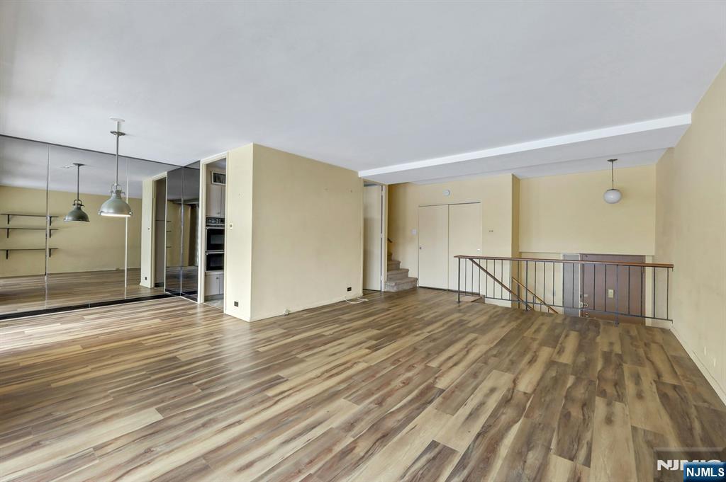 2 Horizon Road, Unit G5 Fort Lee, NJ 07024 - Photo 15 of 46 a view of empty room with wooden floor