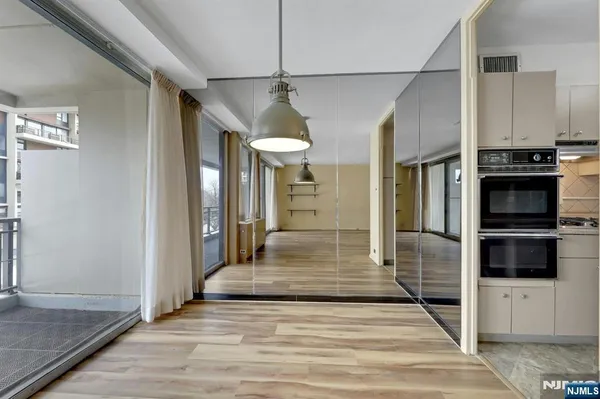 a view of a kitchen from the hallway