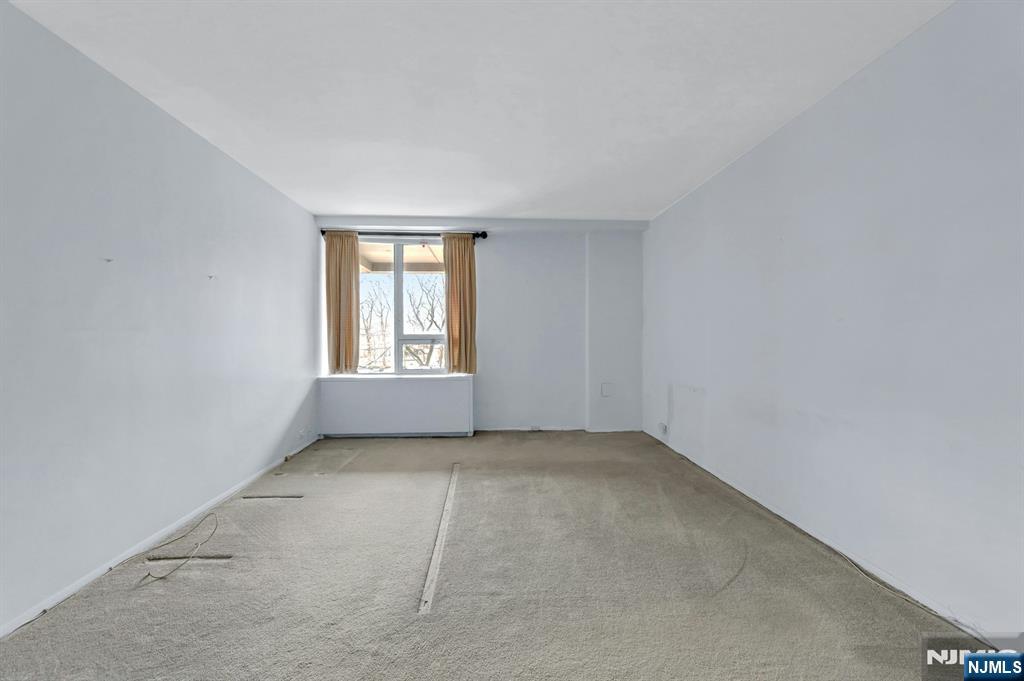 2 Horizon Road, Unit G5 Fort Lee, NJ 07024 - Photo 32 of 46 an empty room with windows