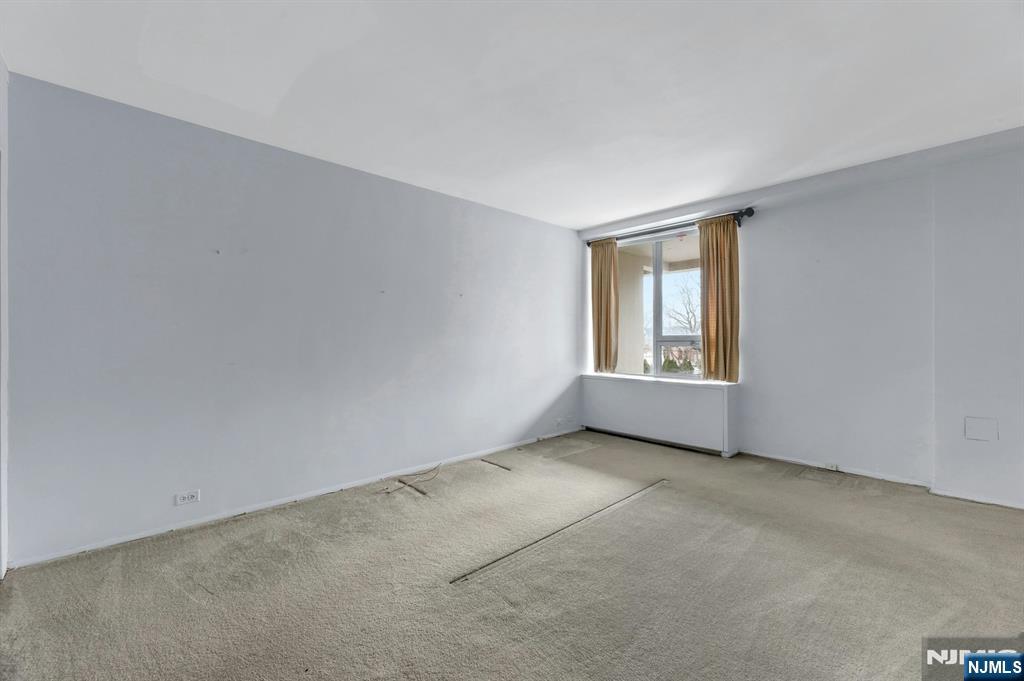 2 Horizon Road, Unit G5 Fort Lee, NJ 07024 - Photo 33 of 46 an empty room with windows