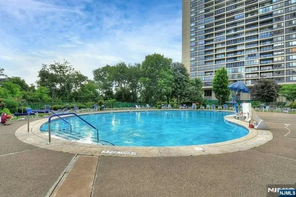 a view of a swimming pool with a patio
