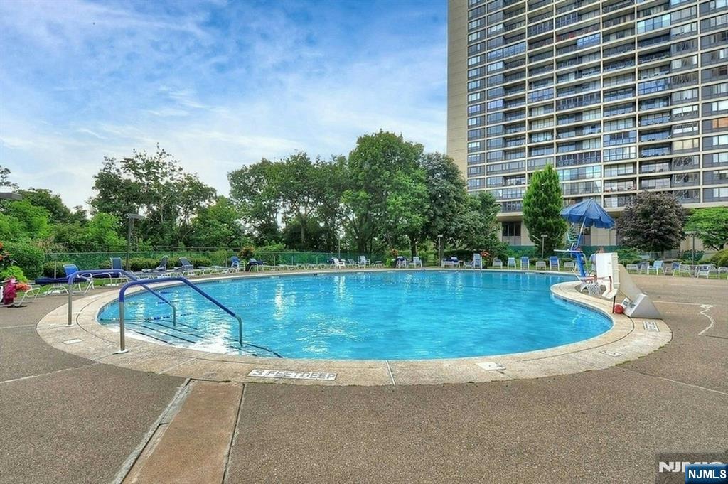 2 Horizon Road, Unit G5 Fort Lee, NJ 07024 - Photo 42 of 46 a view of a swimming pool with a patio