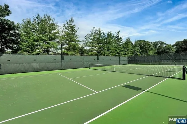 a view of an outdoor space and tennis court