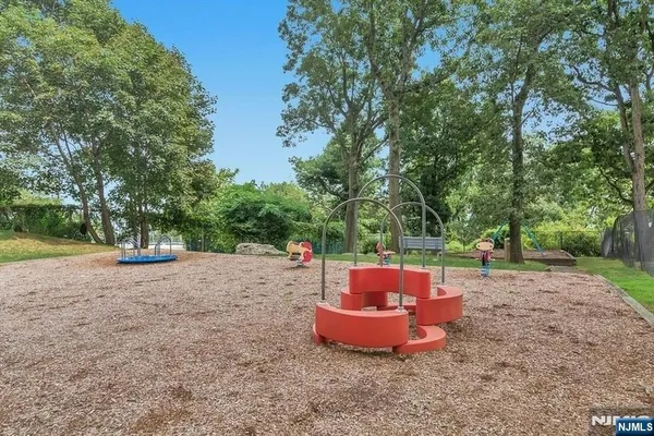 a table and chairs sitting in the middle of a yard