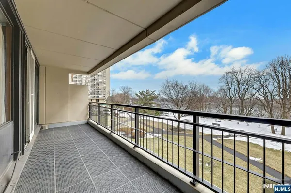 a view of balcony with furniture