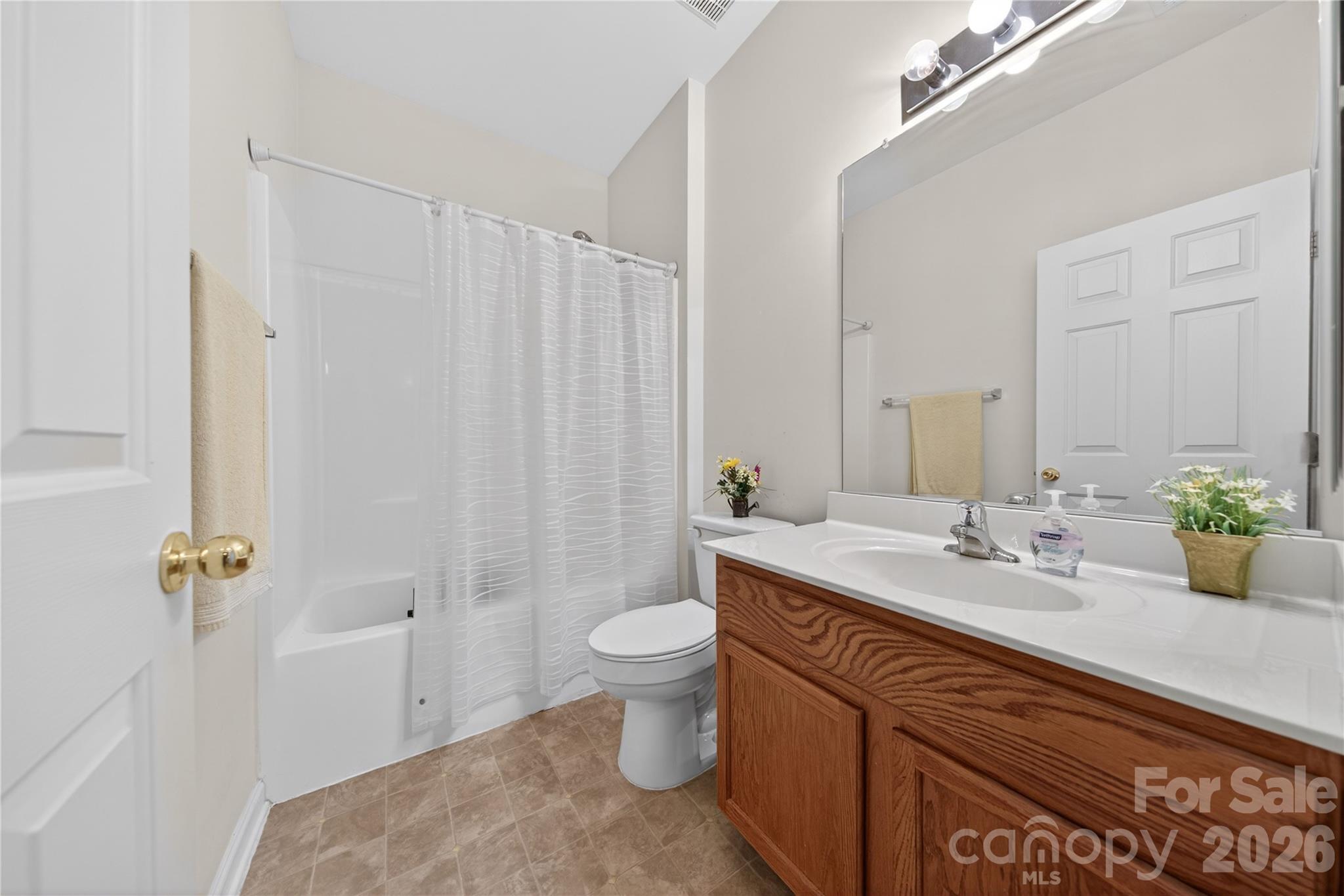 533 Fair Oaks Drive Fort Mill, SC 29708 - Photo 25 of 33 a bathroom with a granite countertop sink a toilet and shower