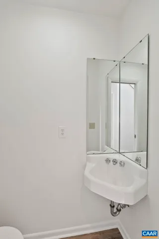 a kitchen with stainless steel appliances granite countertop wooden cabinets stove top oven and sink