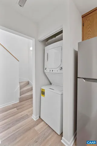 a kitchen with granite countertop kitchen island a sink appliances and a counter space