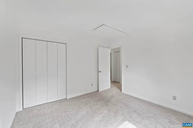 a front view of a house with a garage