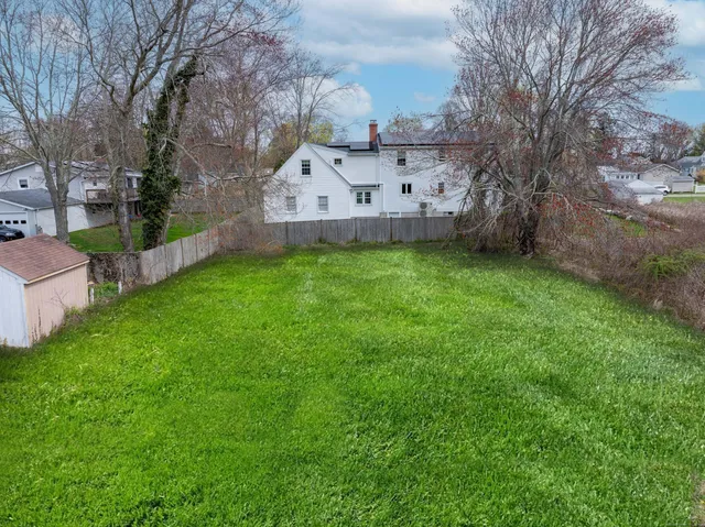a view of a house with a back yard