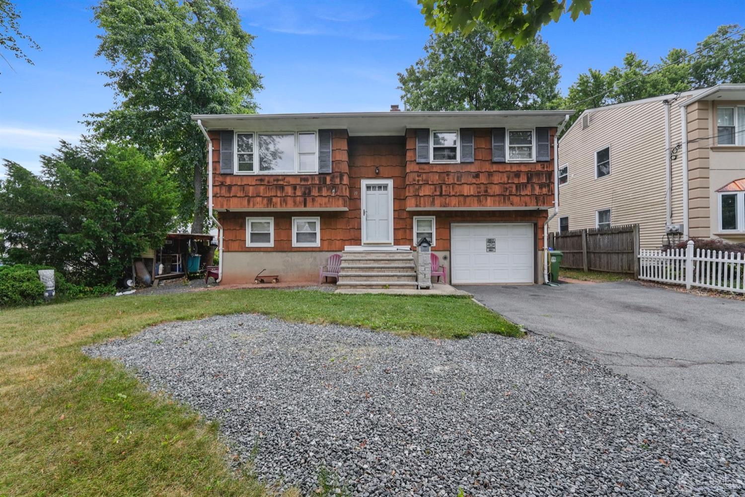 19 Spencer Street Edison, NJ 08817 - Photo 1 of 23 a front view of a house with garden