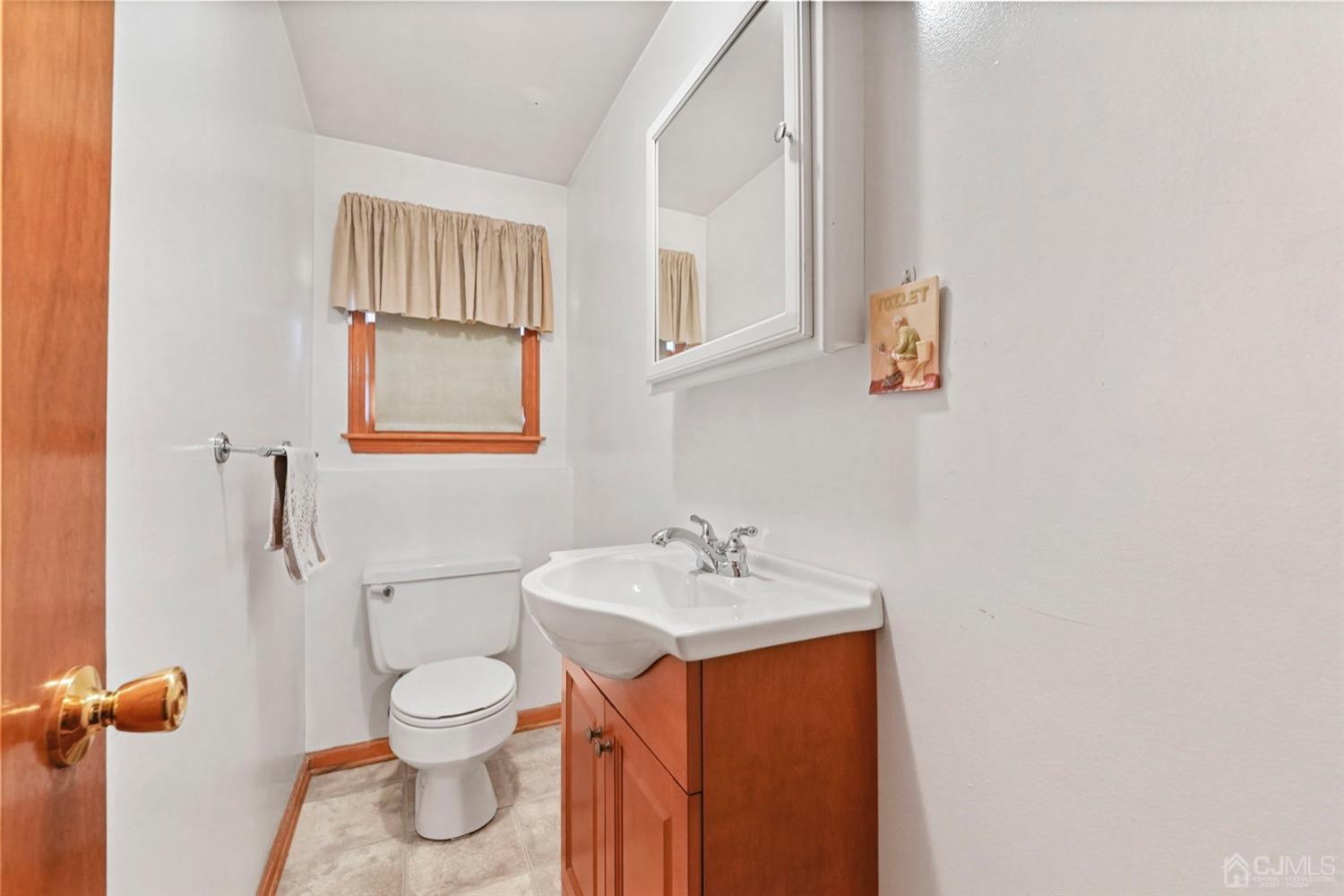 19 Spencer Street Edison, NJ 08817 - Photo 17 of 23 a bathroom with a sink toilet and vanity