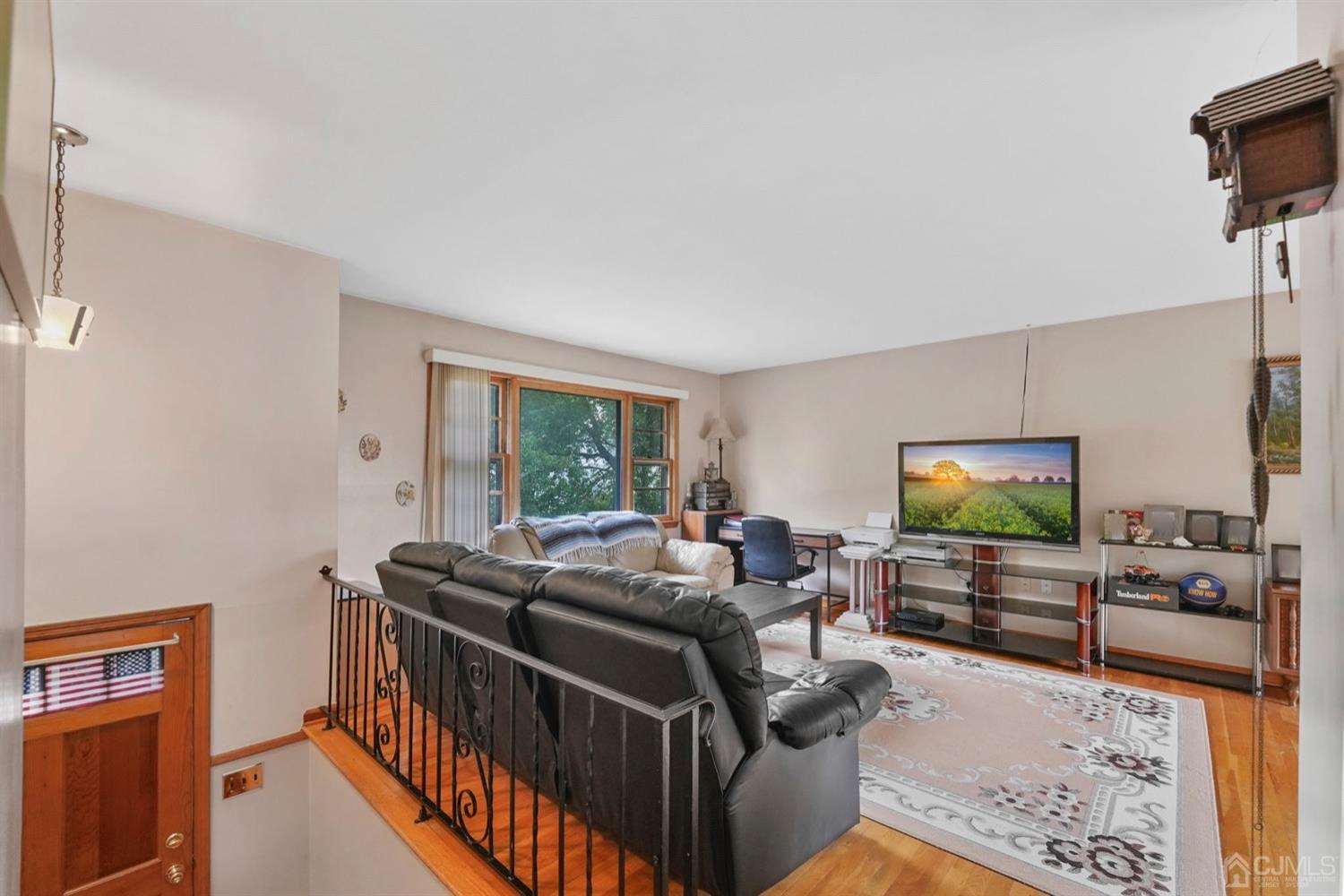 19 Spencer Street Edison, NJ 08817 - Photo 3 of 23 a living room with furniture and a flat screen tv