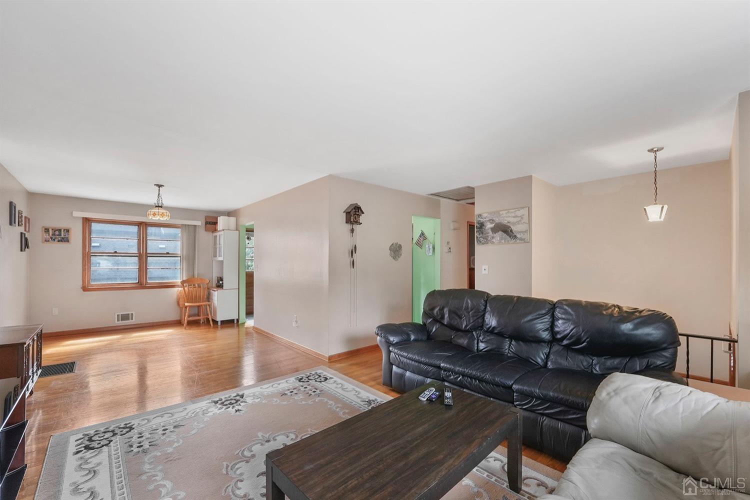 19 Spencer Street Edison, NJ 08817 - Photo 5 of 23 a living room with furniture and wooden floor