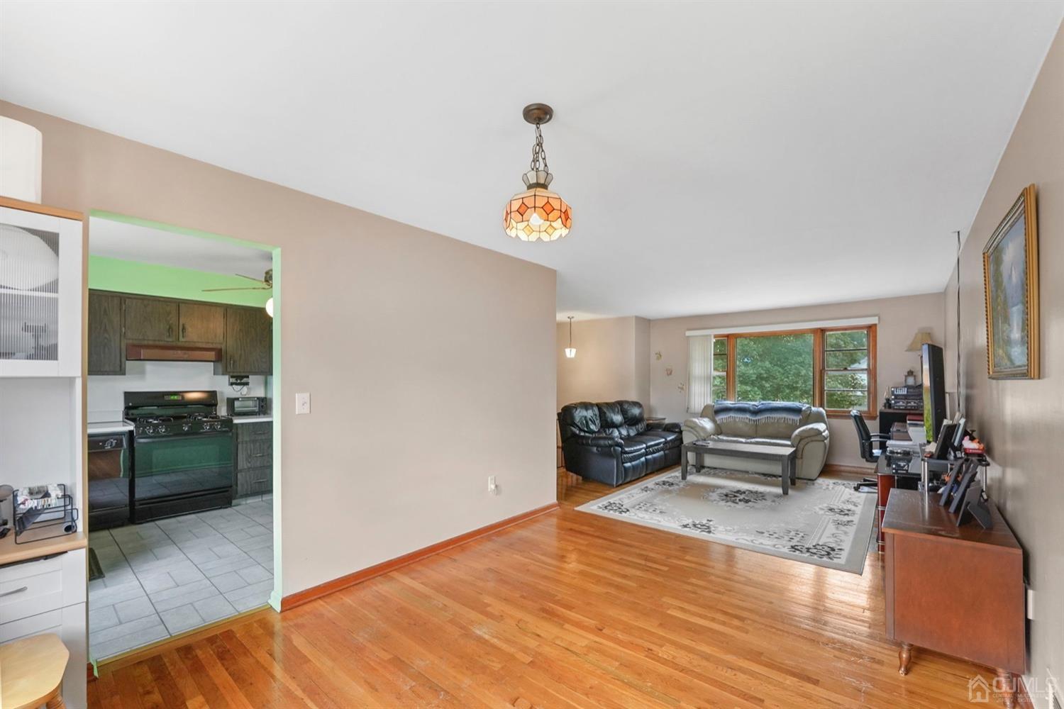 19 Spencer Street Edison, NJ 08817 - Photo 7 of 23 a living room with furniture and a wooden floor