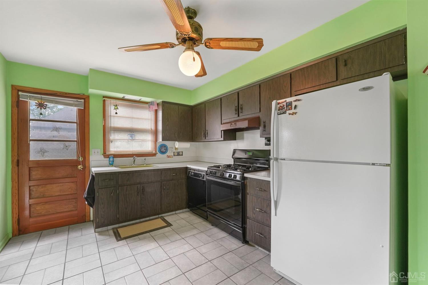 19 Spencer Street Edison, NJ 08817 - Photo 9 of 23 a kitchen with stainless steel appliances granite countertop a refrigerator and a stove top oven