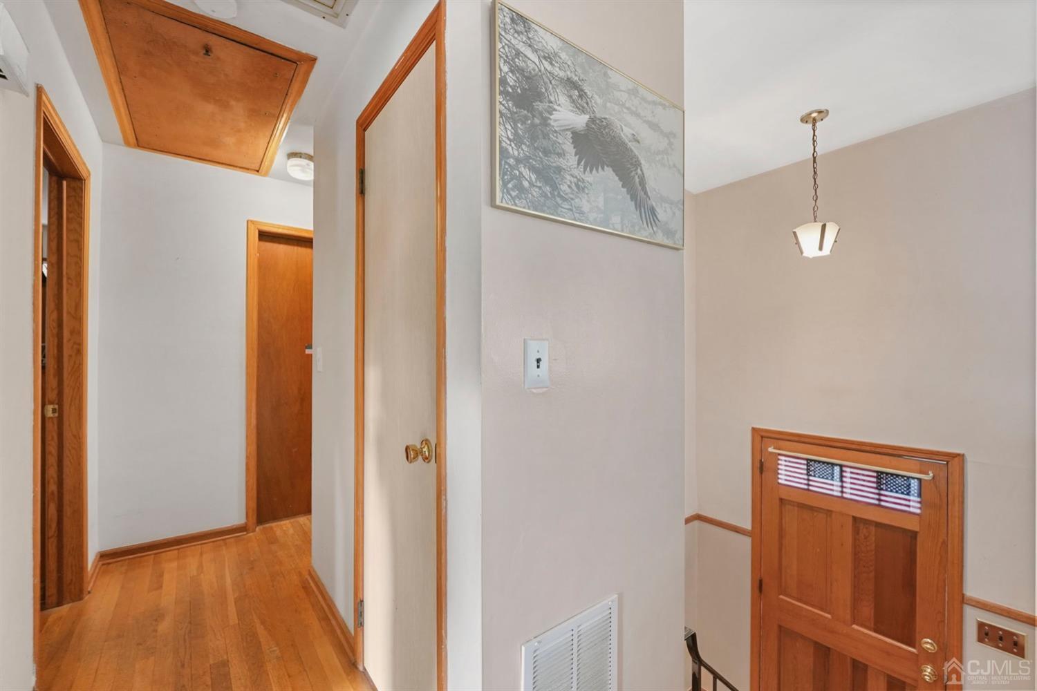19 Spencer Street Edison, NJ 08817 - Photo 10 of 23 a view of a hallway with wooden floor