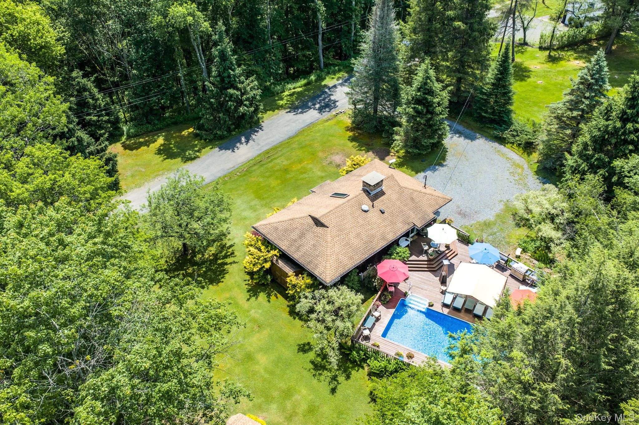 172 Wards Road Livingston Manor, NY 12758 - Photo 46 of 47 Expansive property featuring a private swimming pool, surrounding wood deck, and a gravel driveway