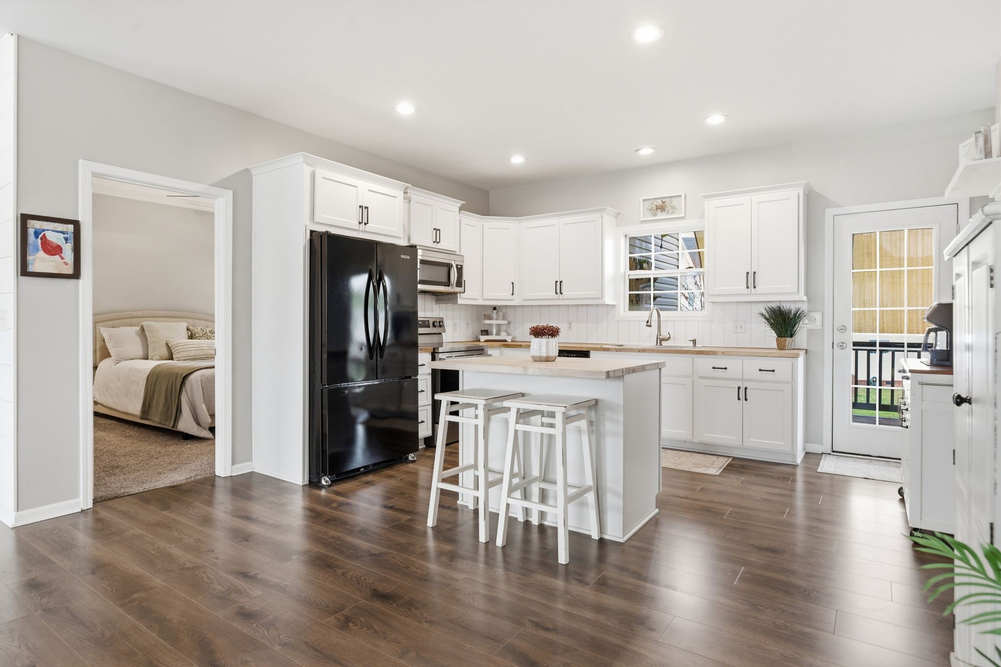 1723 Stephenson Lane Spring Hill, TN 37174 - Photo 18 of 48 a kitchen with white cabinets and stainless steel appliances