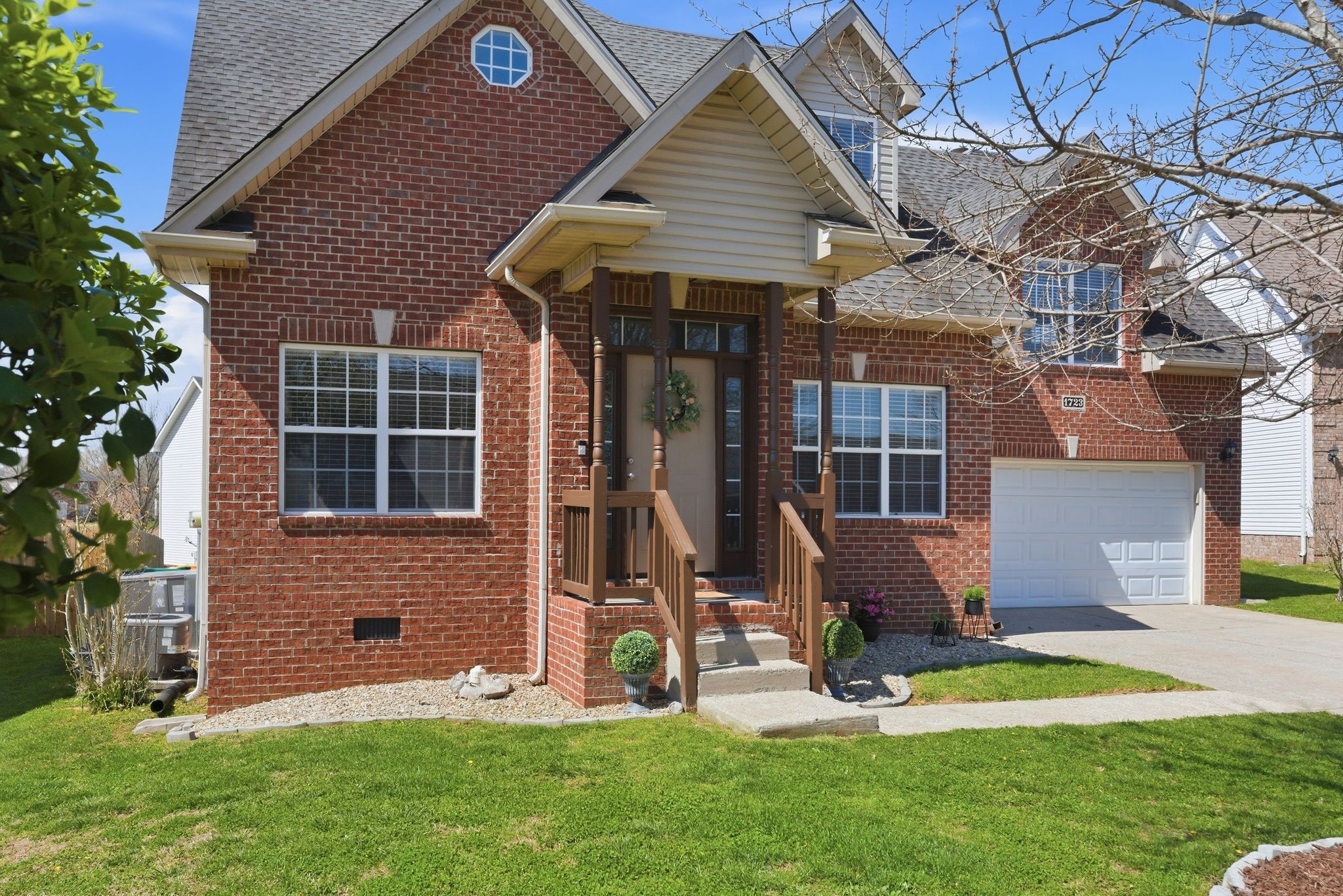 1723 Stephenson Lane Spring Hill, TN 37174 - Photo 2 of 48 a view of a house with a yard porch and sitting area