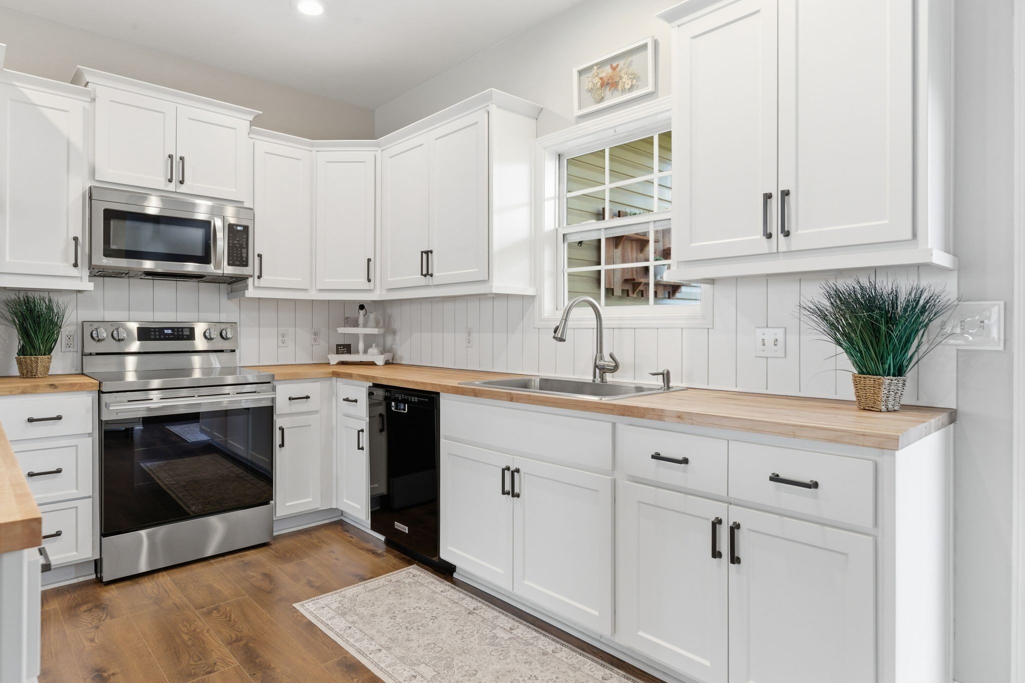 1723 Stephenson Lane Spring Hill, TN 37174 - Photo 21 of 48 a kitchen with stainless steel appliances white cabinets and a sink