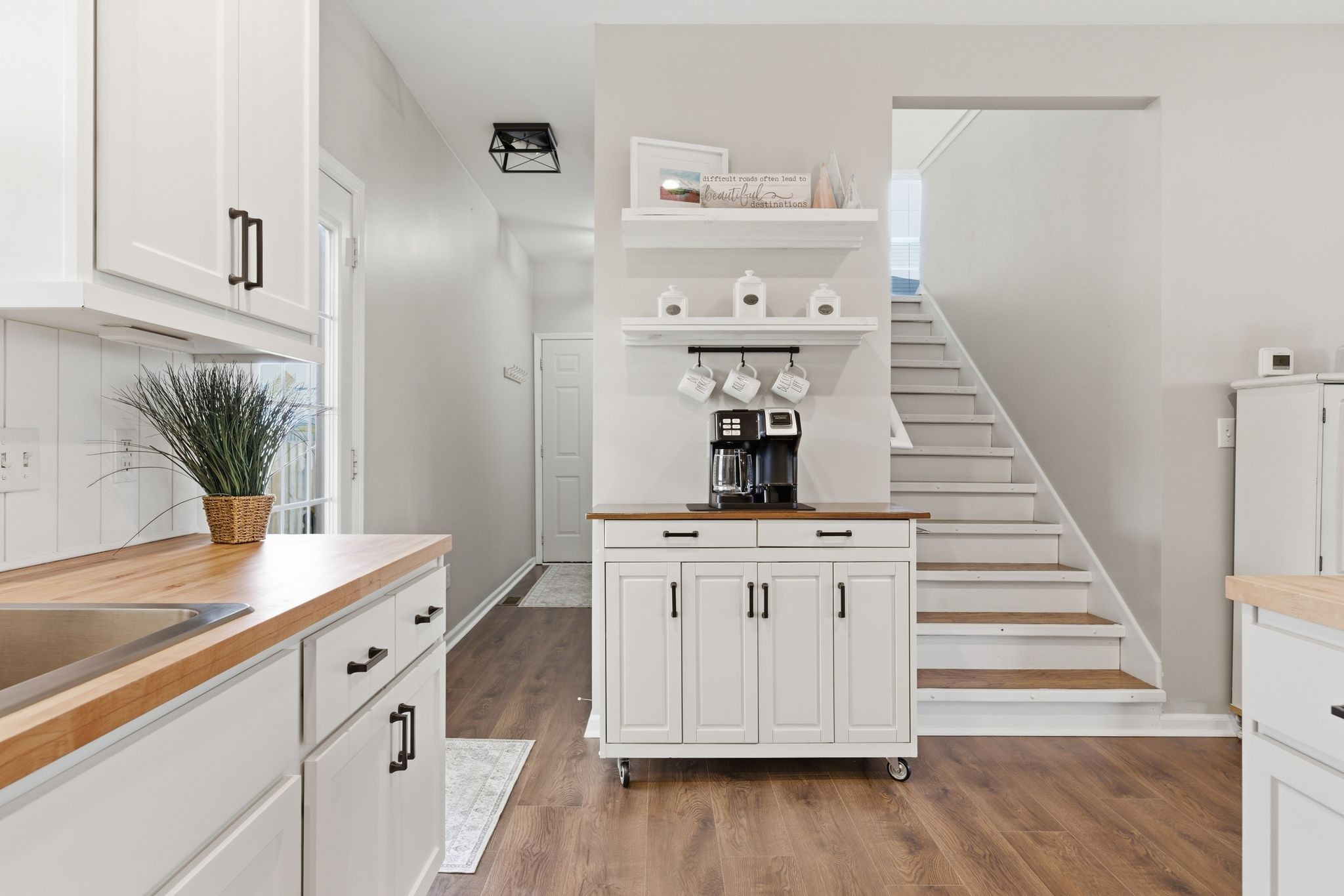 1723 Stephenson Lane Spring Hill, TN 37174 - Photo 23 of 48 a kitchen with white cabinets and appliances