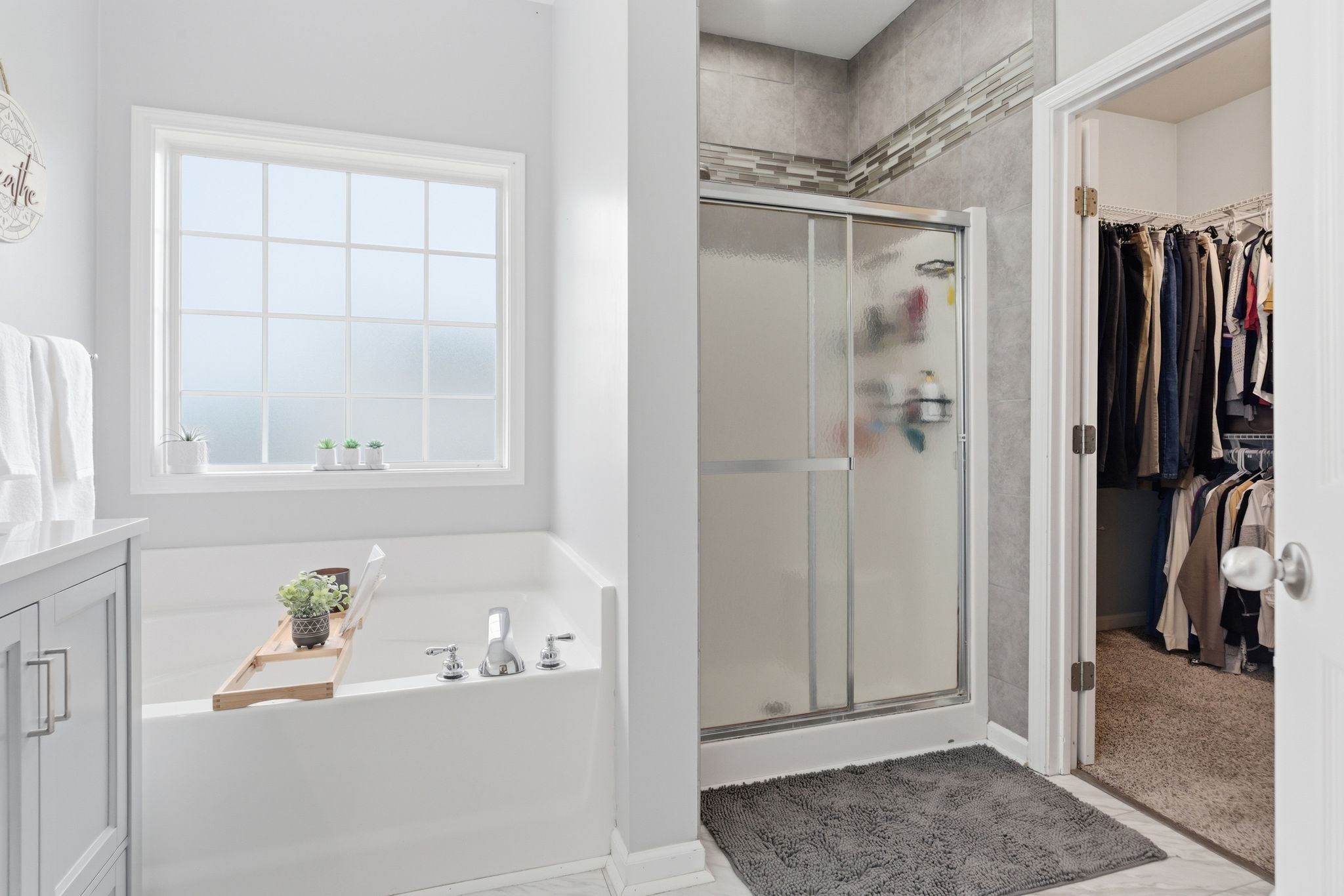 1723 Stephenson Lane Spring Hill, TN 37174 - Photo 30 of 48 a bathroom with a bathtub and a shower