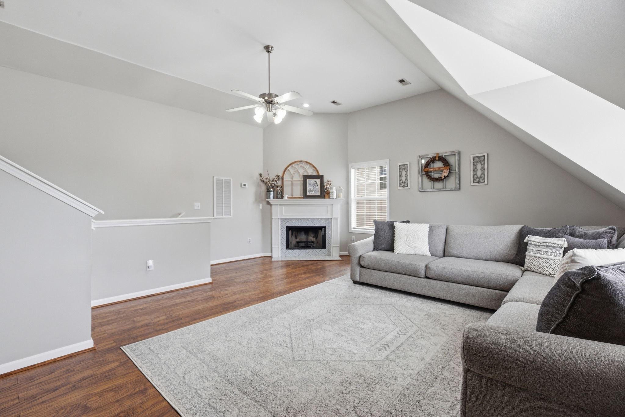 1723 Stephenson Lane Spring Hill, TN 37174 - Photo 33 of 48 a living room with furniture a fireplace and a ceiling fan