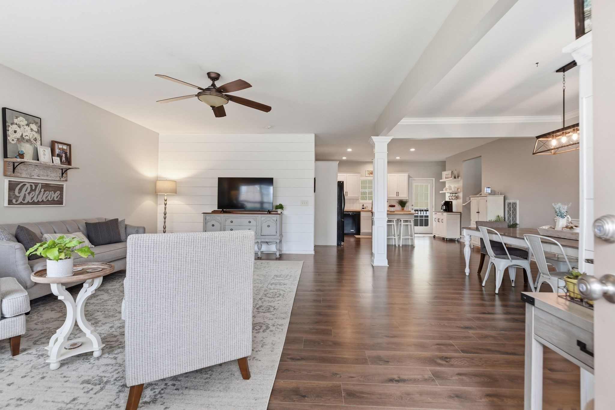1723 Stephenson Lane Spring Hill, TN 37174 - Photo 4 of 48 a living room with furniture a fireplace and a flat screen tv
