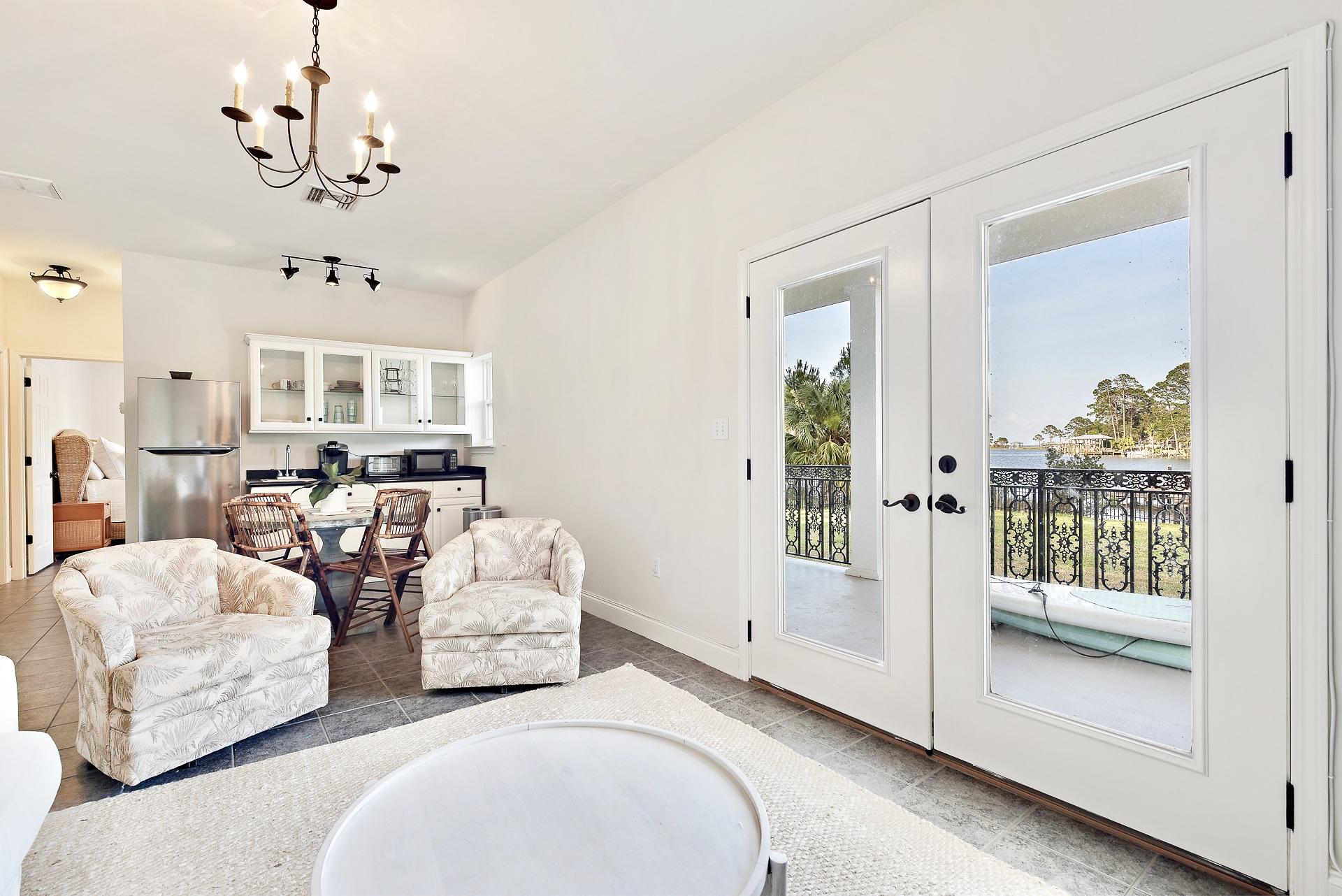 368 West Harborview Road Santa Rosa Beach, FL 32459 - Photo 50 of 60 a living room with furniture and a chandelier