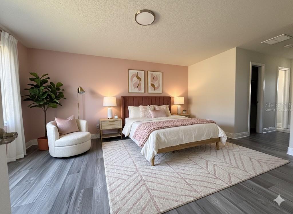 587 North Riva Ridge Path Inverness, FL 34453 - Photo 11 of 44 a bedroom with a bed and a couch