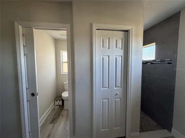 a view of a bathroom from the hallway