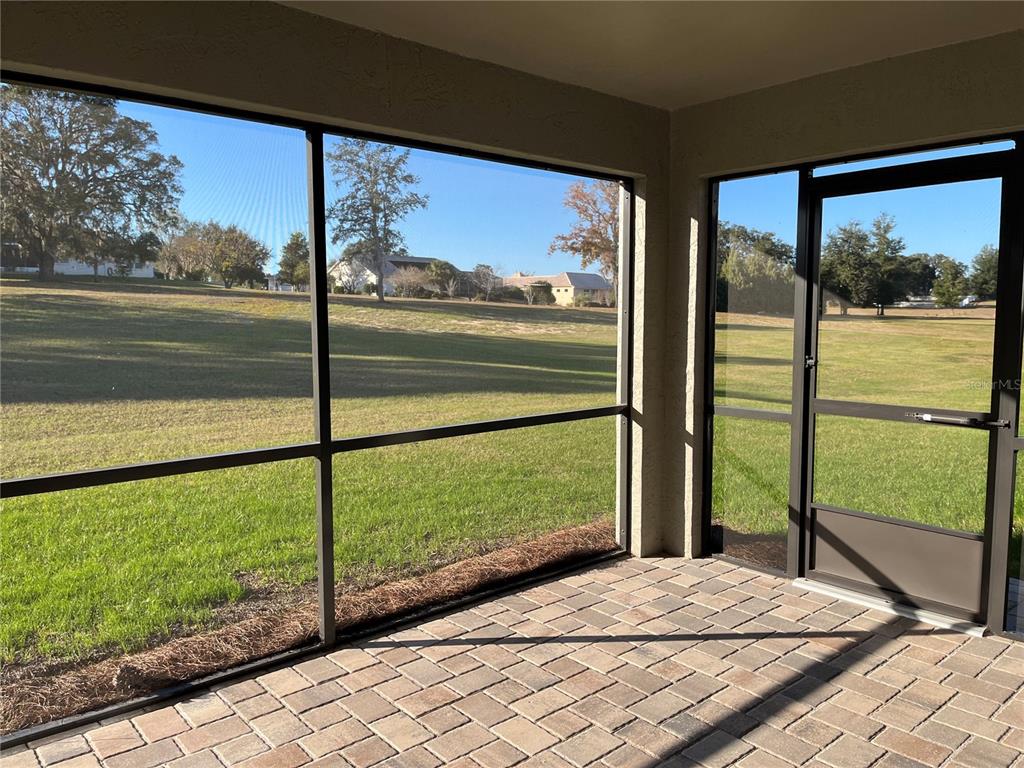 587 North Riva Ridge Path Inverness, FL 34453 - Photo 20 of 42 a view of lot of a lake from a window