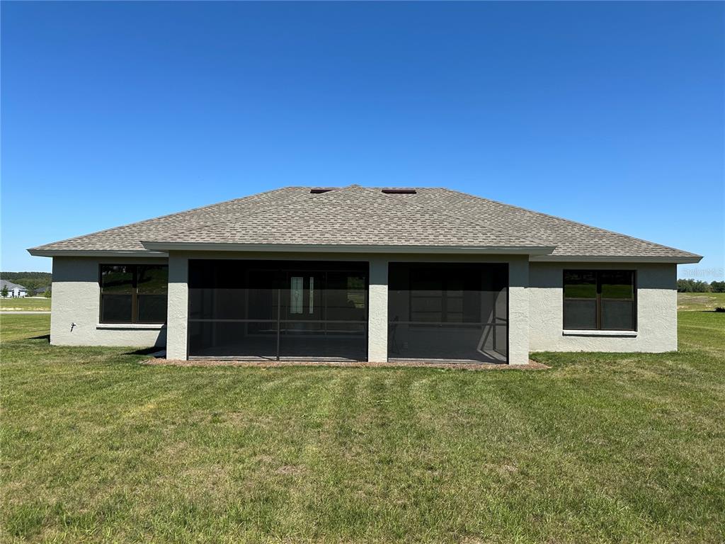 587 North Riva Ridge Path Inverness, FL 34453 - Photo 24 of 44 a front view of a house with yard