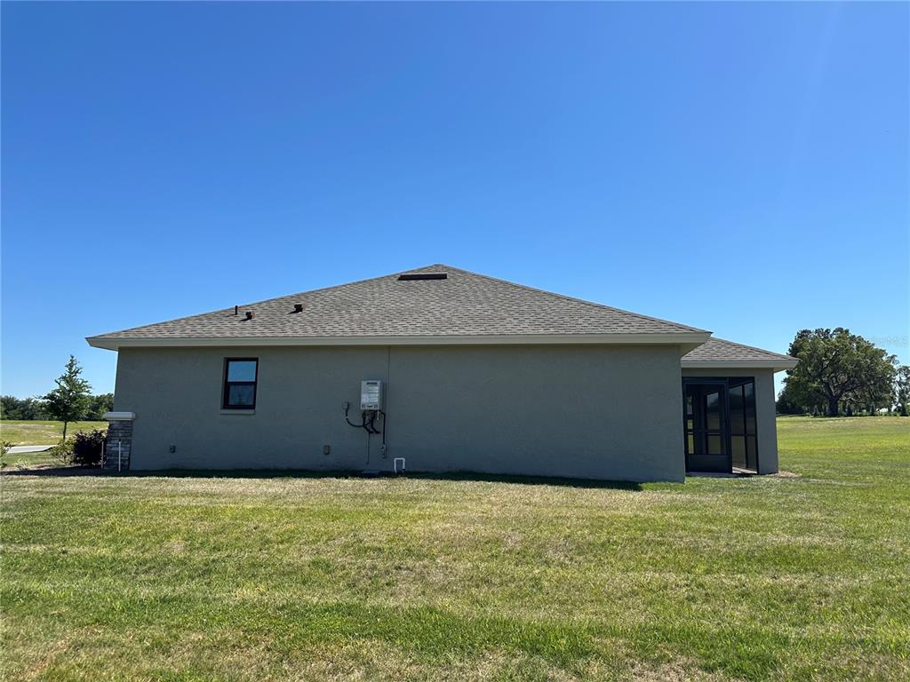 587 North Riva Ridge Path Inverness, FL 34453 - Photo 25 of 42 a front view of a house with a yard