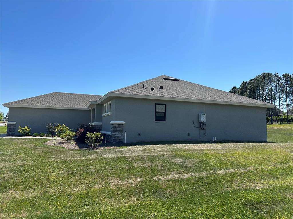 587 North Riva Ridge Path Inverness, FL 34453 - Photo 26 of 44 a backyard of a house