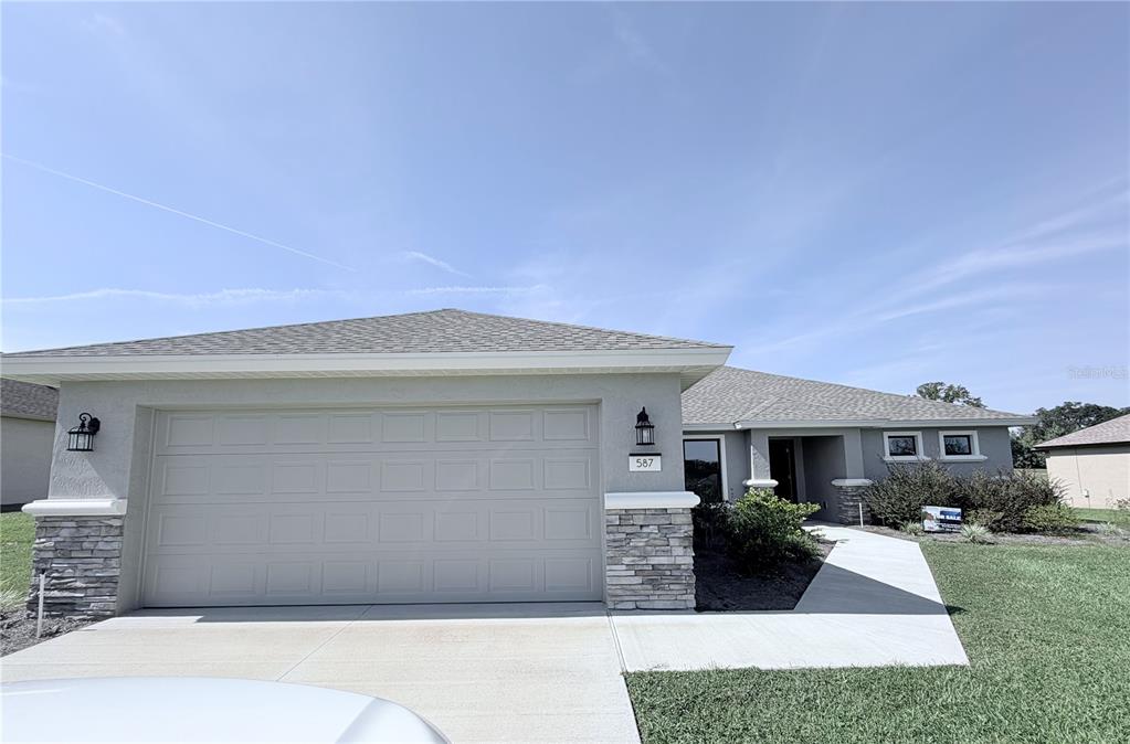 587 North Riva Ridge Path Inverness, FL 34453 - Photo 5 of 42 a front view of house with yard