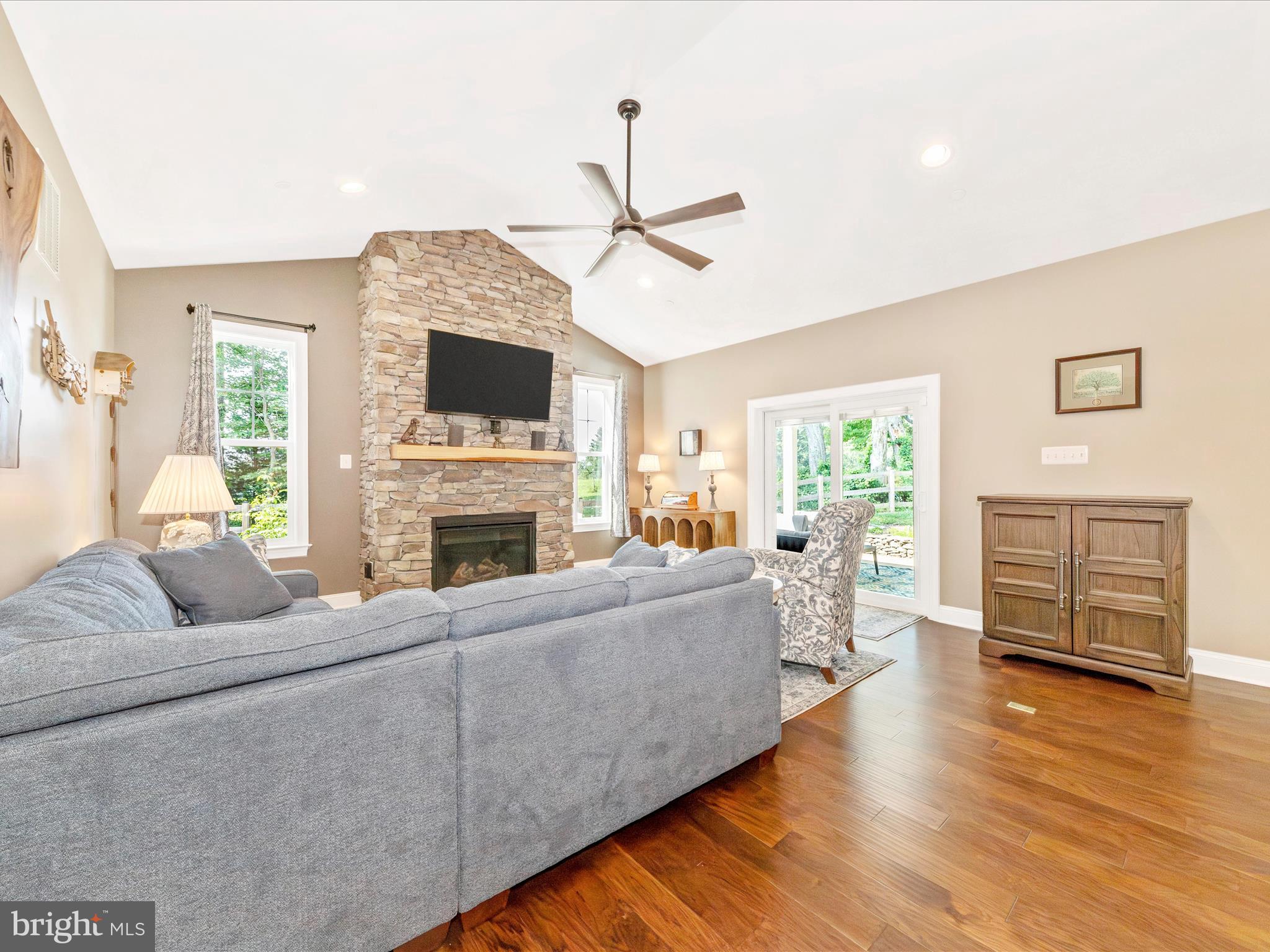 7788 Old Receiver Road Frederick, MD 21702 - Photo 13 of 51 a living room with furniture a flat screen tv and a fireplace