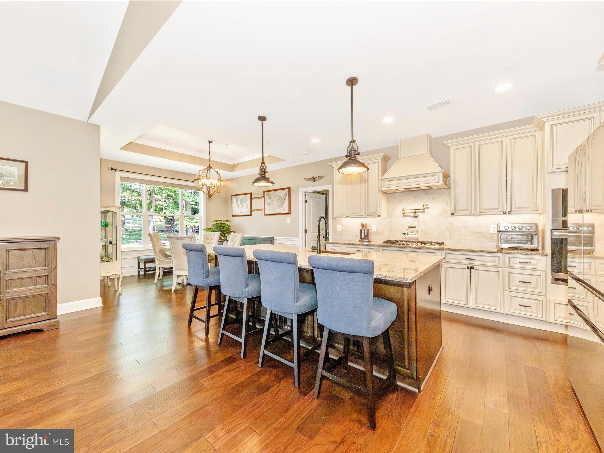 7788 Old Receiver Road Frederick, MD 21702 - Photo 14 of 51 a dining hall with stainless steel appliances a dining table chairs and view living room