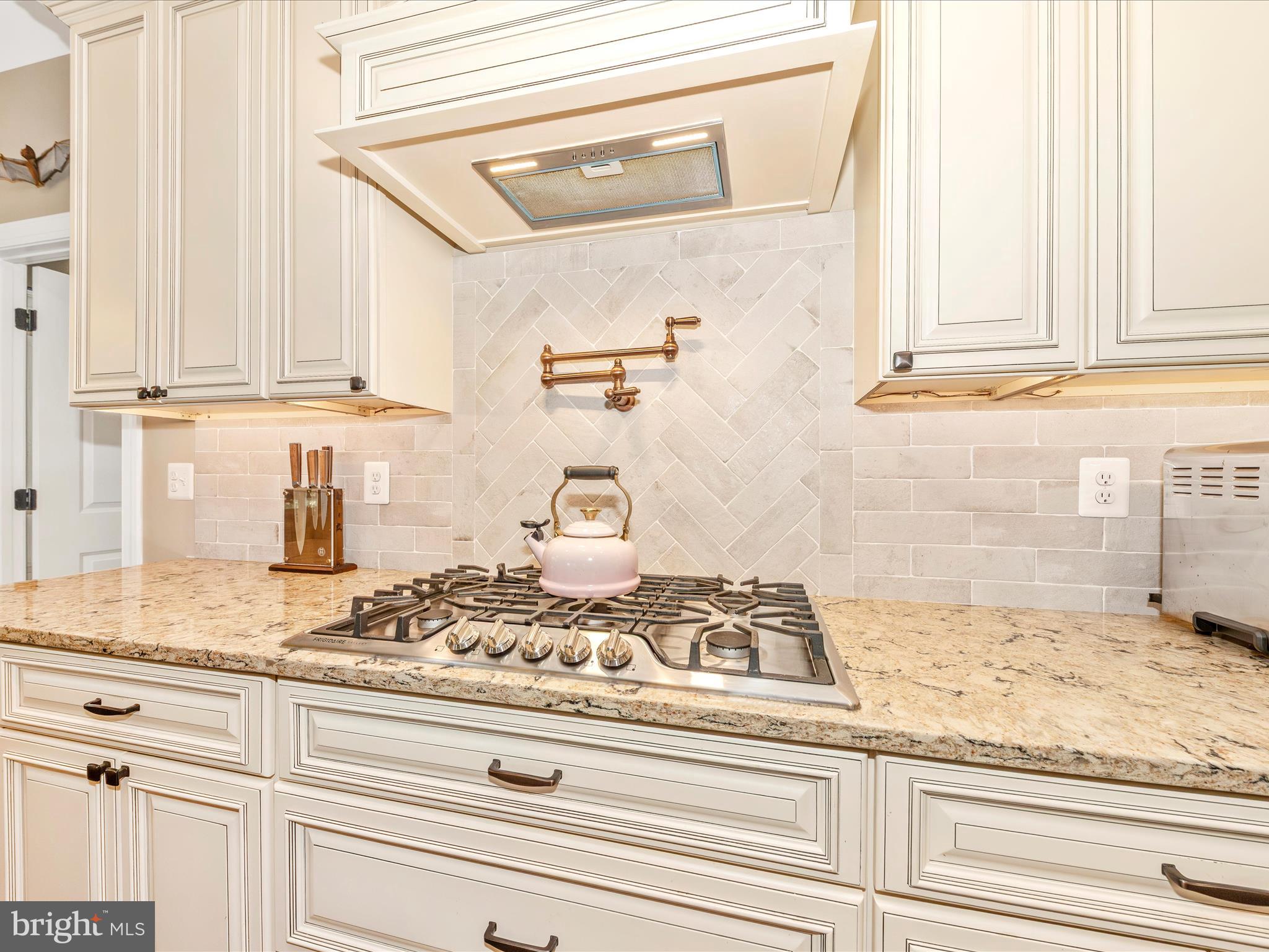 7788 Old Receiver Road Frederick, MD 21702 - Photo 16 of 51 a kitchen with granite countertop white cabinets and appliances